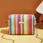 Small woven straw handbag with bright multicolor bands