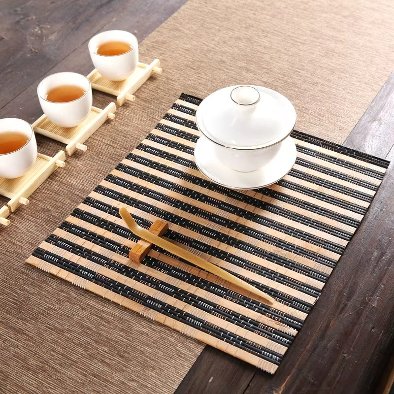 Small rectangular hand woven bamboo placemat in beige and black tones