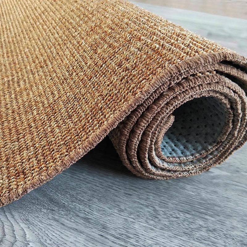 Small natural fiber flatweave rug in a living room
