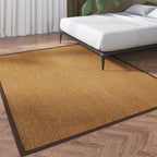 Small beige flatweave rug with a brown fabric border
