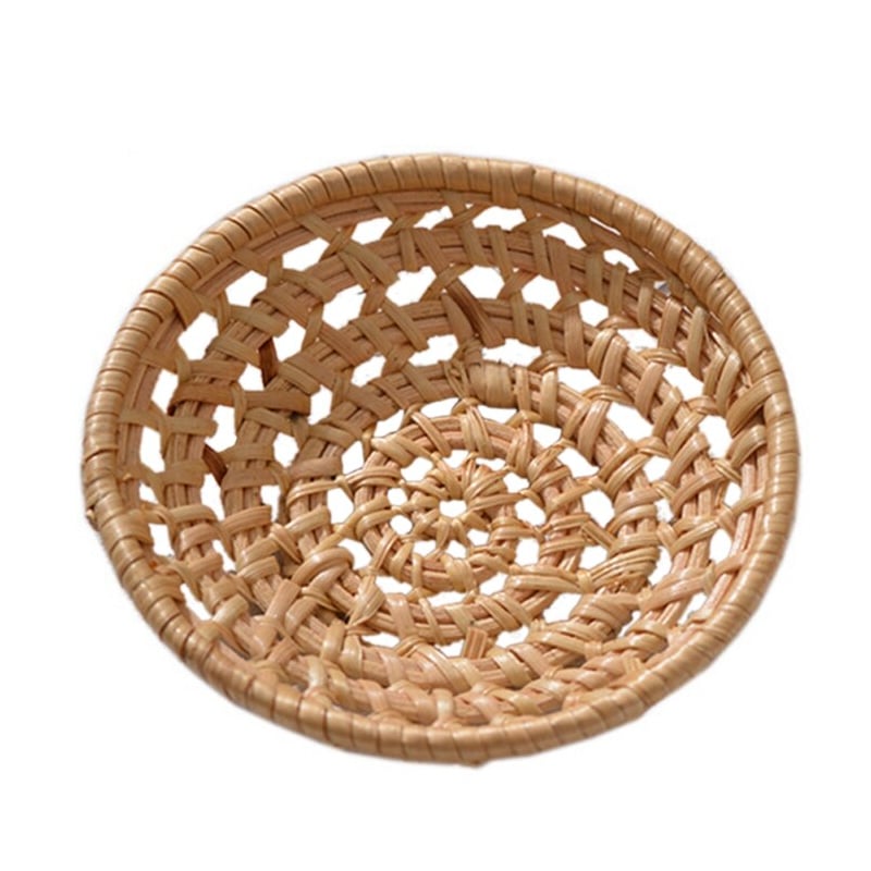 Small round open weave rattan bowls on a table