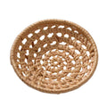 Small round open weave rattan bowls on a table