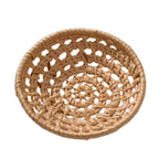 Small round open weave rattan bowls on a table