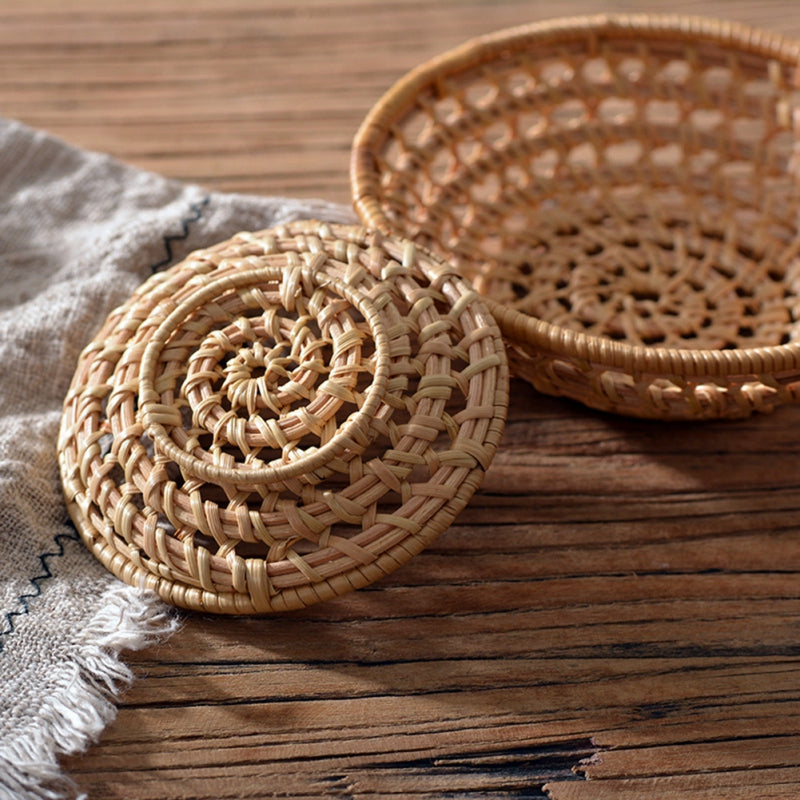 Small round openwork rattan bowls on a table