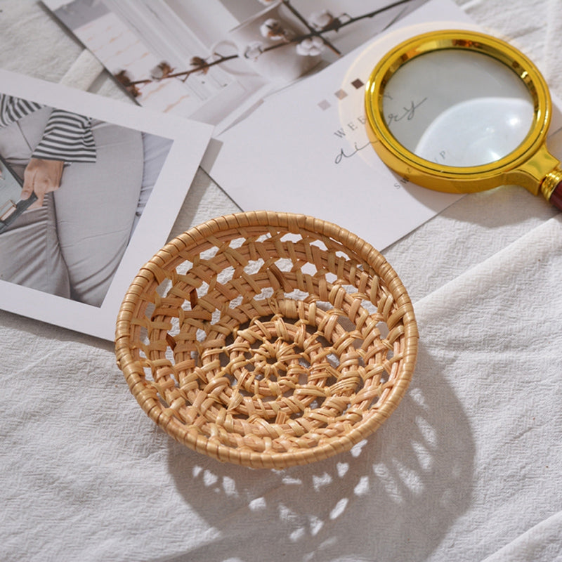 Small round openwork rattan bowls on a table