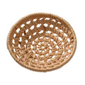 Small round openwork rattan bowls on a table