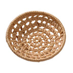 Small round openwork rattan bowls on a table
