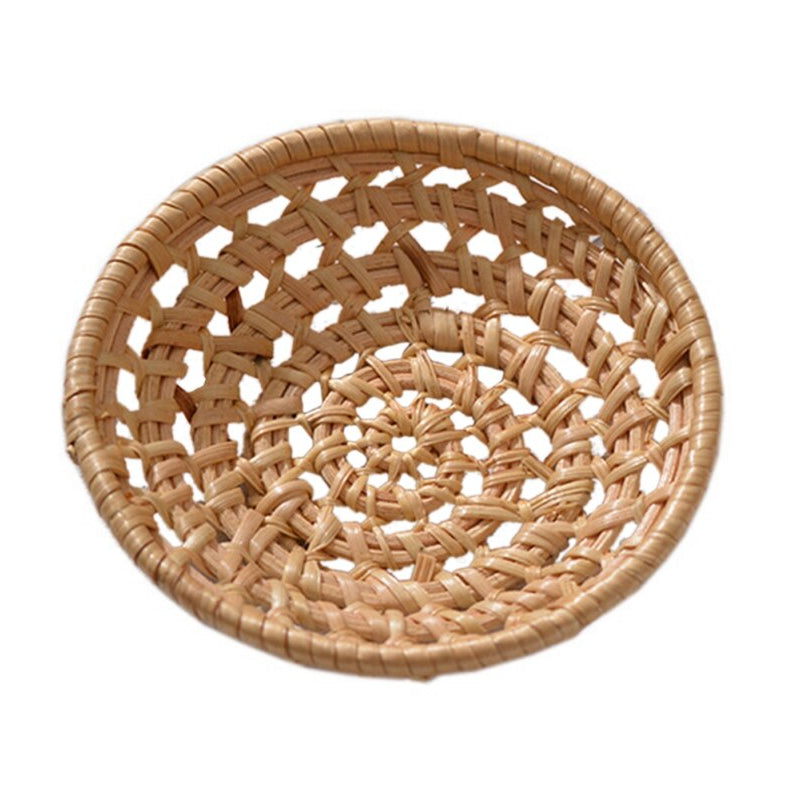 Small round openwork rattan bowls on a table