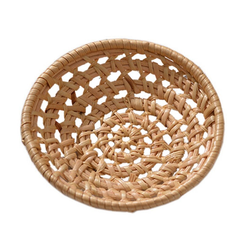 Small round openwork rattan bowls on a table