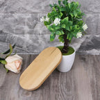 Small oval bamboo tray with a smooth raised rim