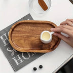 Small oval woven bamboo tray in caramel brown
