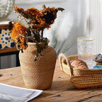 Small handwoven rattan urn shaped vase