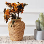 Small handwoven rattan urn shaped vase