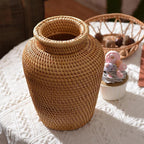 Small handwoven rattan urn shaped vase