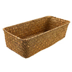 Small narrow rectangular woven baskets holding napkins and jars