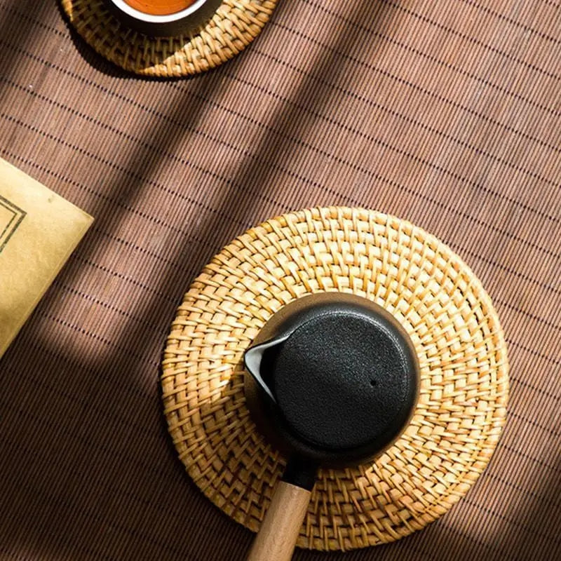 Small round hand woven rattan and bamboo mat with a tight even weave