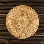 Small round hand woven rattan and bamboo mat with a tight even weave