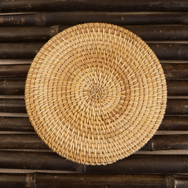 Small round hand woven rattan and bamboo mat with a tight even weave
