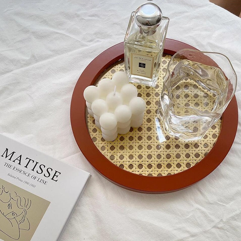 Small round handwoven rattan tray with raised rim