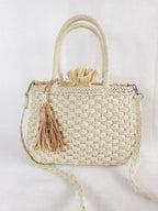 Small round hand woven rattan handbag with a double top handle and removable strap