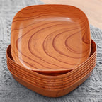 Small square plate with a warm wood grain and rounded corners