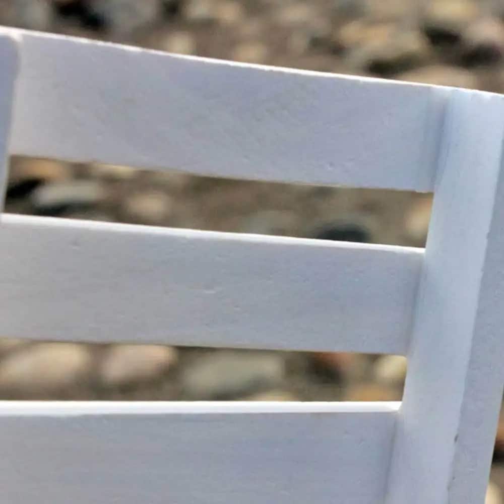 Small white wood shelf for plants and garden accessories