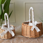 Two small woven baskets with lace wrapped handles and bows