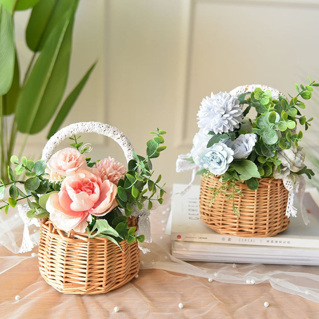 Two small woven baskets with lace wrapped handles and bows