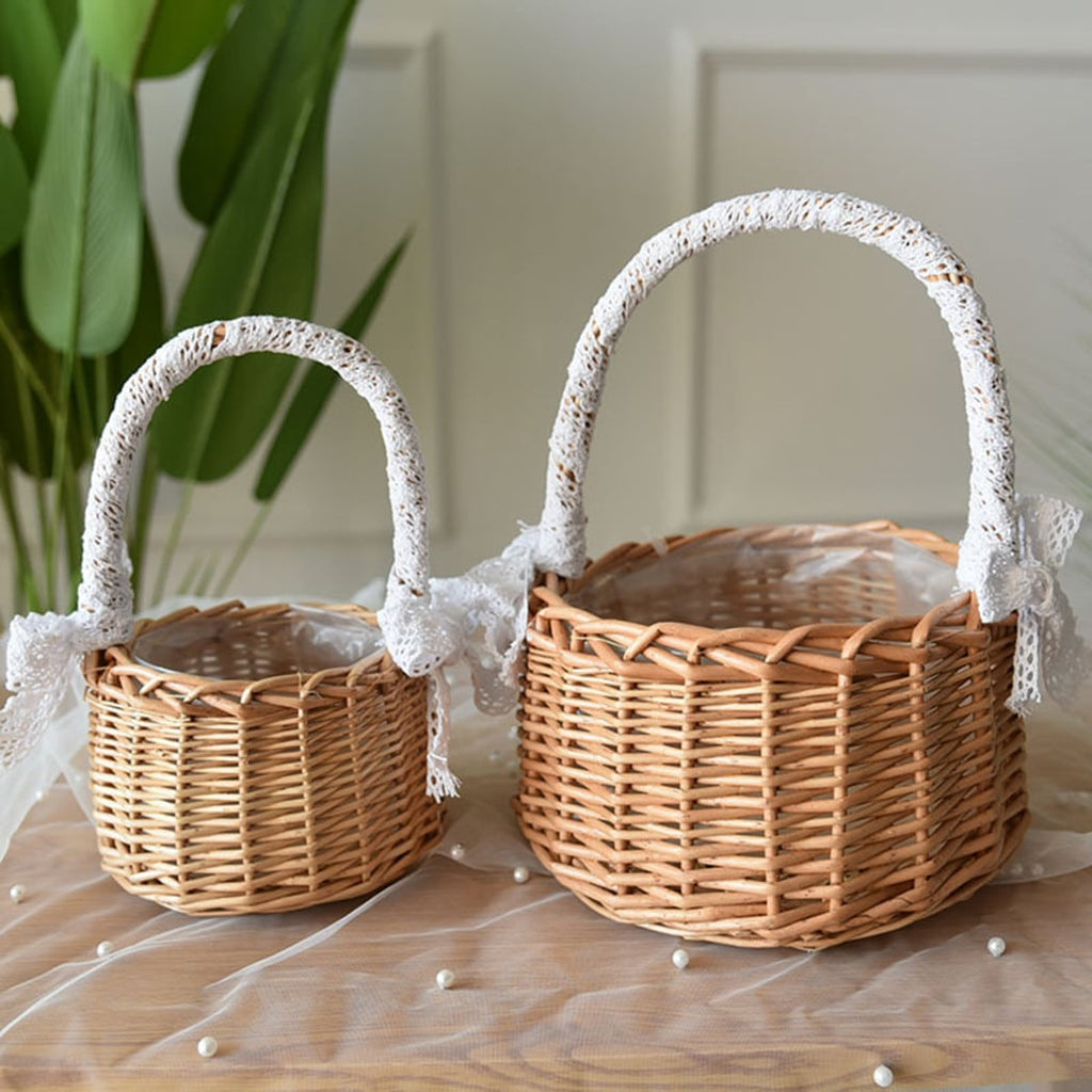 Two small woven baskets with lace wrapped handles and bows