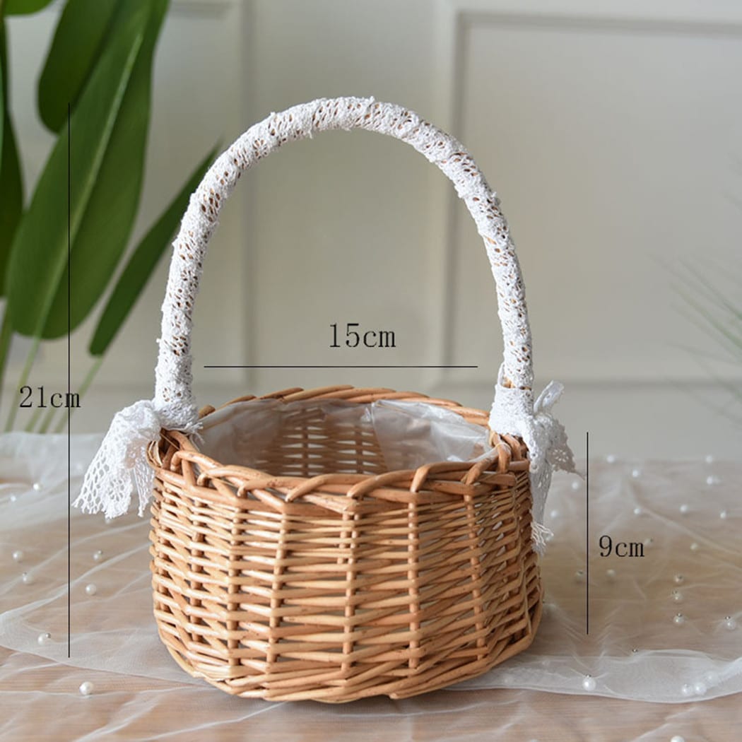 Two small woven baskets with lace wrapped handles and bows