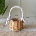 Two small woven baskets with lace wrapped handles and bows