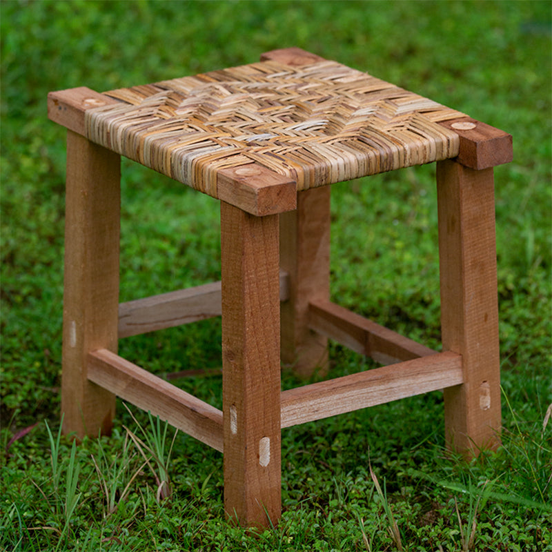 Small square stool with a multi tone woven top on a solid wood frame