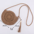 Soft round woven straw shoulder bag with a removable adjustable strap