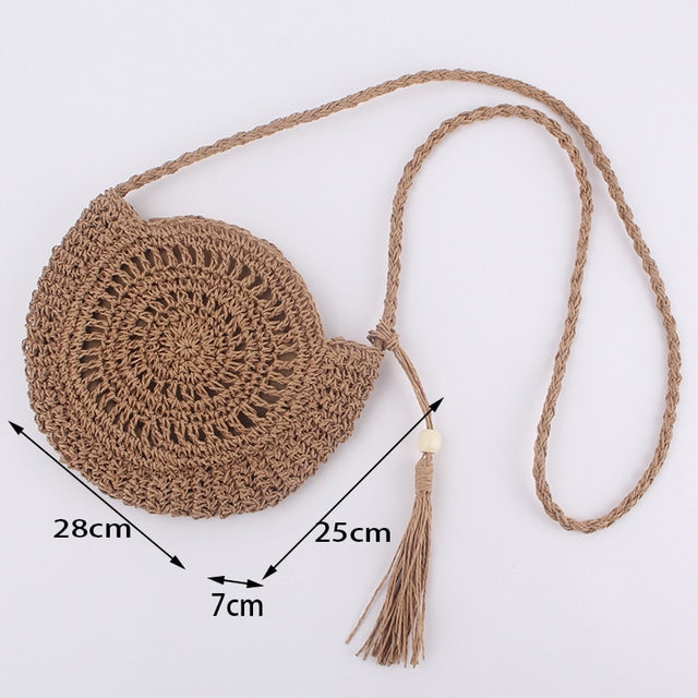 Soft round woven straw shoulder bag with a removable adjustable strap