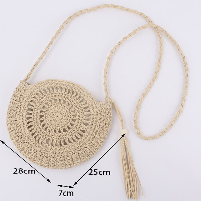 Soft round woven straw shoulder bag with a removable adjustable strap
