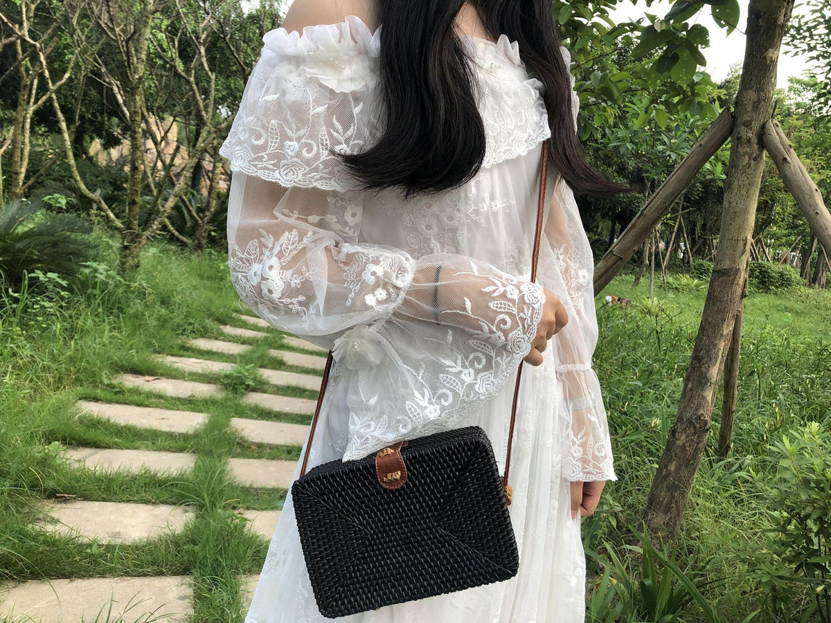 Square hand woven rattan shoulder bag in a boho style