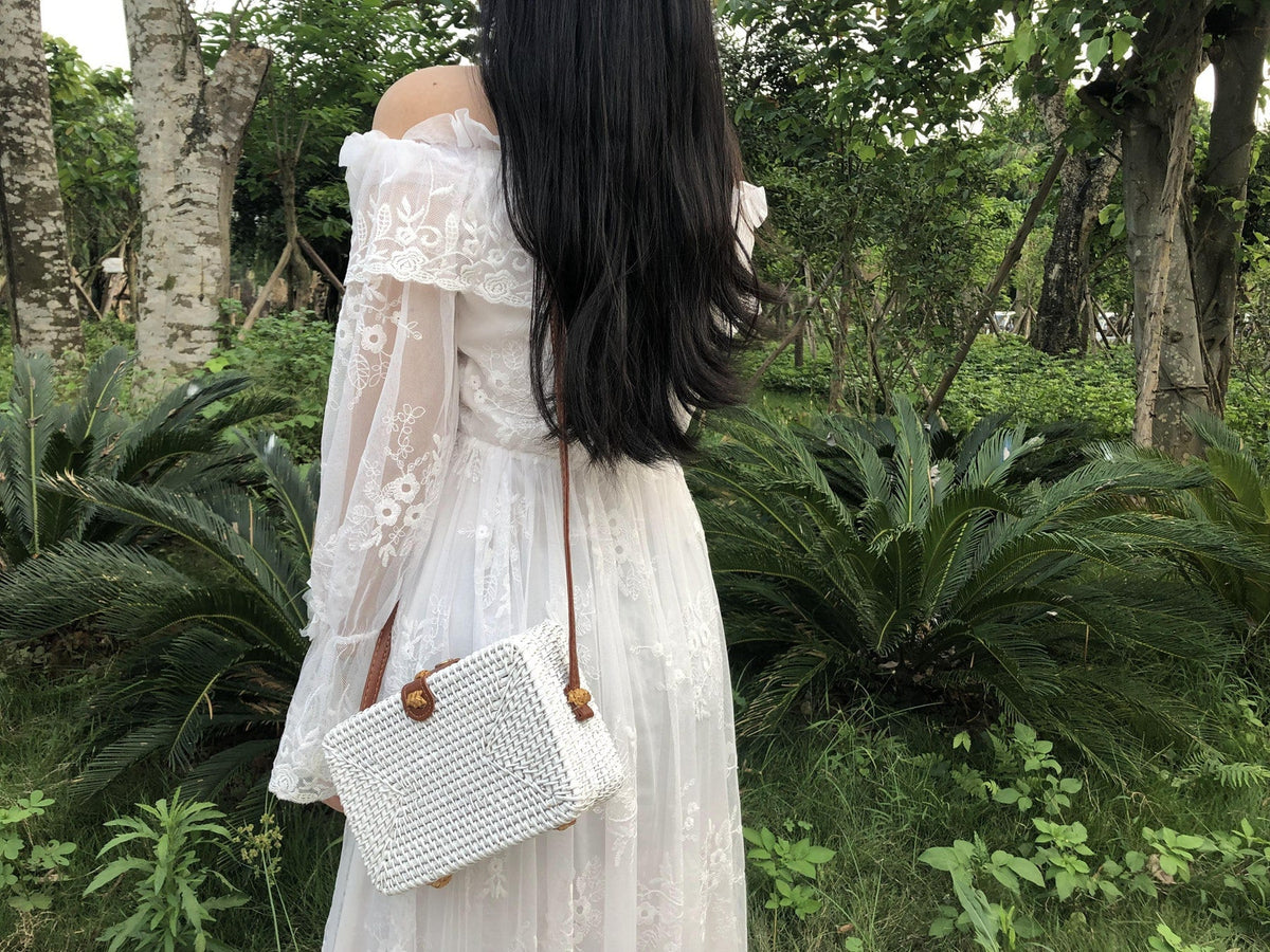 Square hand woven rattan shoulder bag in a boho style