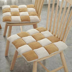 Square chair cushion with an off white and warm brown check pattern