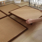 Square woven rattan floor mats with brown borders
