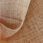 Roll of natural rattan cane webbing with a square open mesh