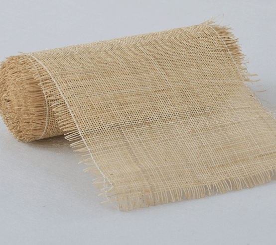 Roll of natural rattan cane webbing with a square open mesh