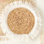 Square hand woven rattan placemat with fine threads woven along the edge