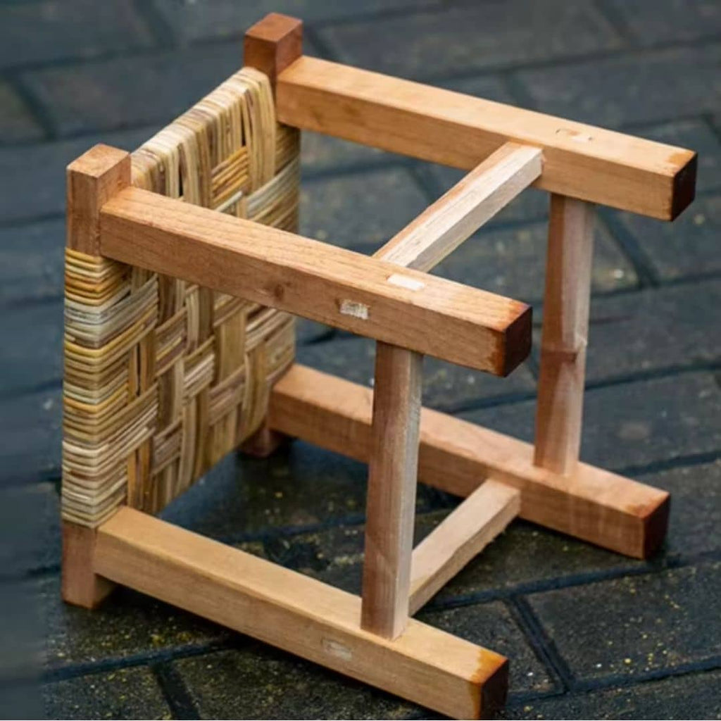 Square hand woven wicker stool on a solid wood frame
