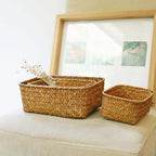 Square woven basket holding dried flowers