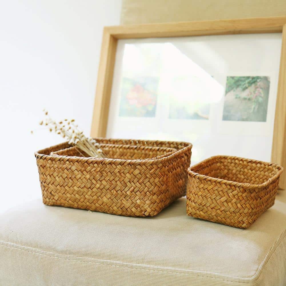 Square woven basket holding dried flowers