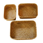 Square woven basket holding dried flowers