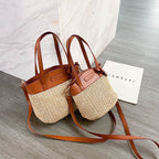 Hand woven straw handbag with smooth faux leather edging and strap