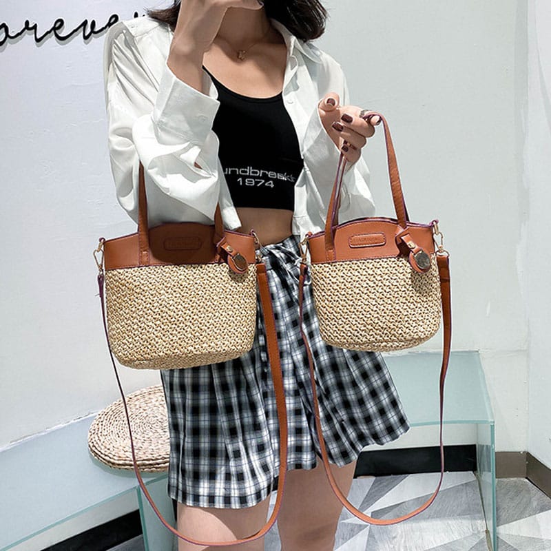 Hand woven straw handbag with smooth faux leather edging and strap