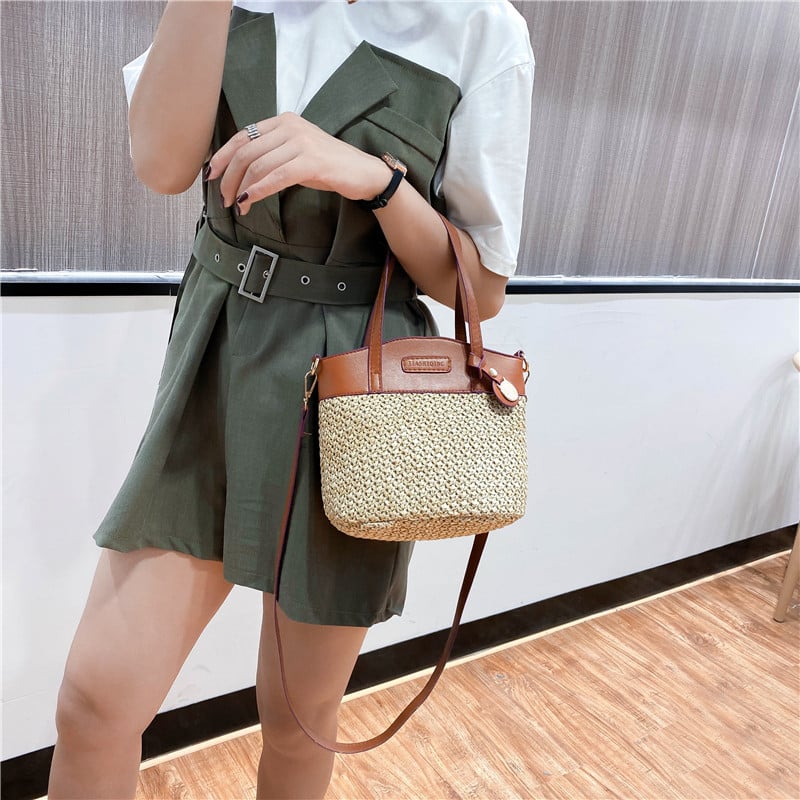 Hand woven straw handbag with smooth faux leather edging and strap