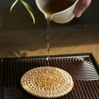 Round tightly woven rattan coaster in a warm honey brown